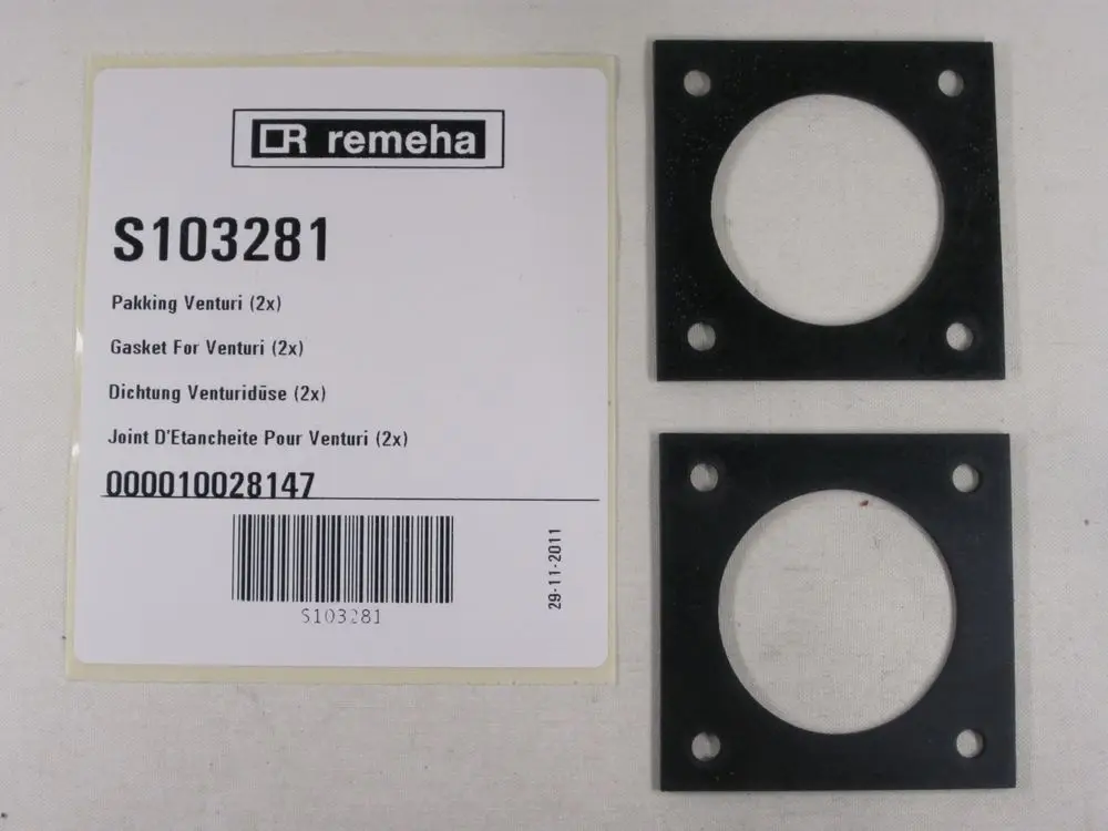 Zwei schwarze Dichtungen mit runder Öffnung und gebohrten Löchern, verpackt mit einer Remeha-Produktbeschreibung und Barcode.